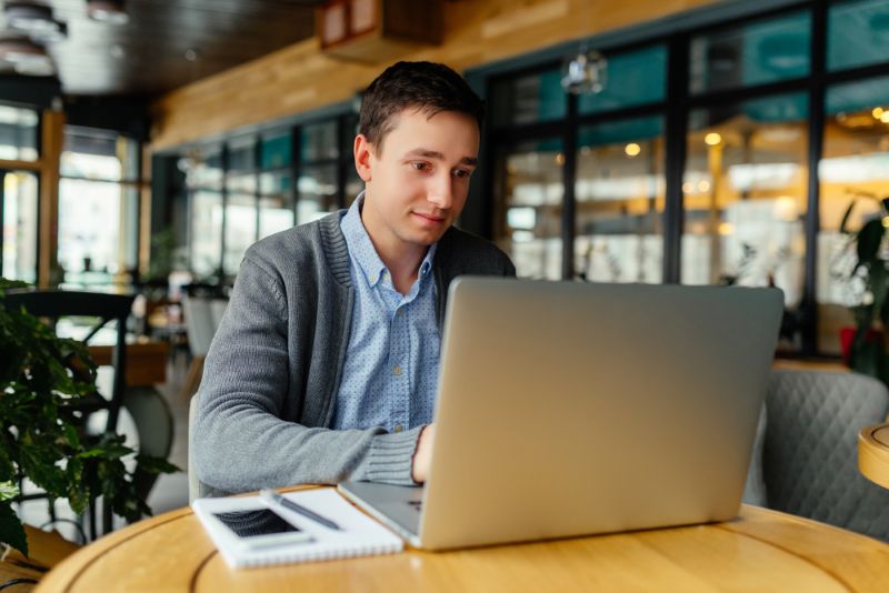 lawyer working on his laptop from a coffee shop